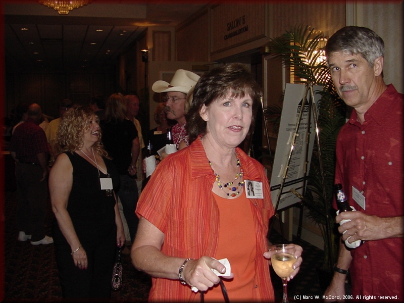 Judy (Bryant) and Woody Thompson (foreground) with Trisha Ramsey talking to Randy Bates (background)