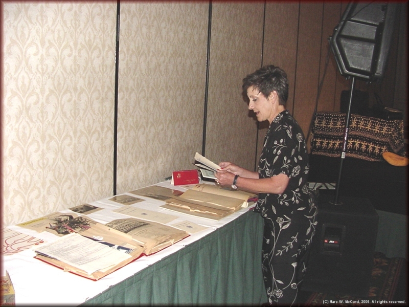 Betty Garvin Garton preparing her memorabilia table display