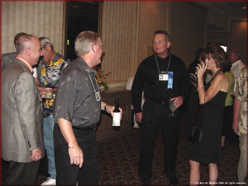 Walt Stierhoff and Robert Nelson visit with Monty Roberts and Carol Speckman