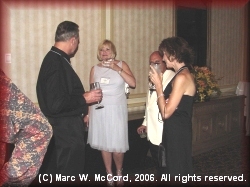 Monty Roberts and Carol Speckman visit with Camille and Bradley Rife on Saturday night