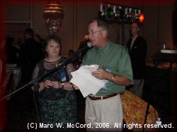 Jackie Hosea Salomon and Bob McComas make announcements at the reunion