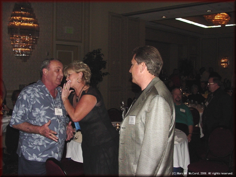 Carl DeWeise talking with Pam Hare Bazet and Jim Bazet on Saturday night