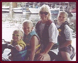 Sarah and her three sons on the jet ski