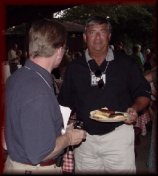 Jerry Dominy talking with Bill Simpson at the 35th Reunion, 2001