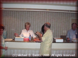Arline Pitt, Pam Hare Bazet, Walt Stierhoff and Bob McComas at the registration desk