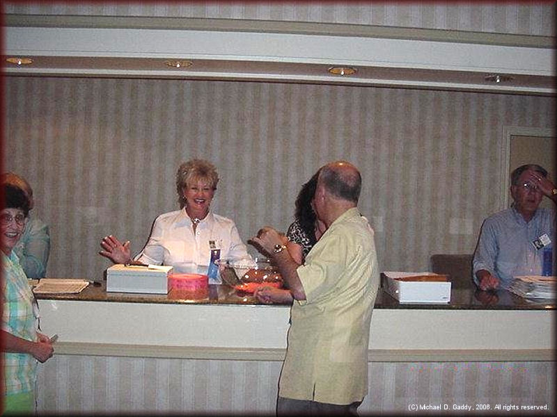 Arline Pitt, Pam Hare Bazet, Walt Stierhoff and Bob McComas at the registration desk